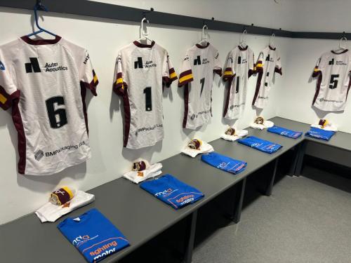 MNDA t-shirts ready in the academy changing rooms